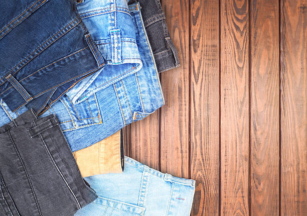 istock Jeans on a wooden table 502289192