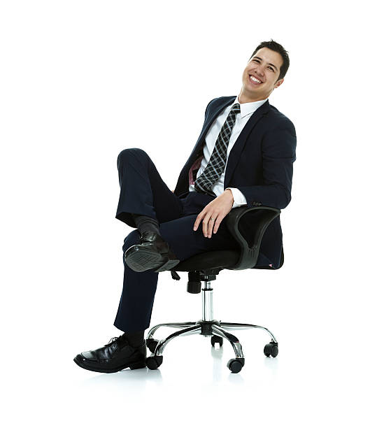 istock Smiling businessman sitting on chair 502291144