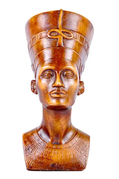 Wood statue of pharaoh on a white background.