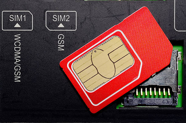 istock Red SIM card on slots in mobile phone. 502291536