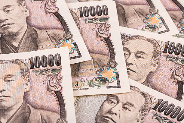 istock Stack of Japanese currency yen or Japanese banknotes 502292330