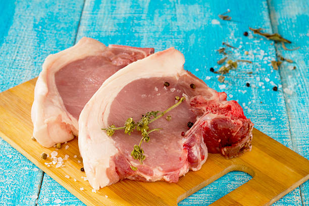 istock Raw meat: fresh beef pork on a wooden table 502293548