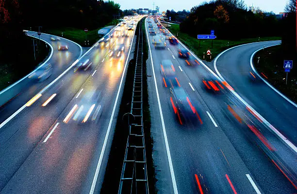 cars on Autobahn highway in Germany in high speed at night