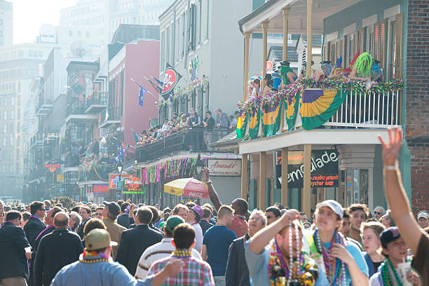 Crowd at Mardi Gras - New Orleans Beads and crowds on Bourbon Street during Mardi Gras in New Orleans, Louisiana. new orleans mardi gras stock pictures, royalty-free photos & images