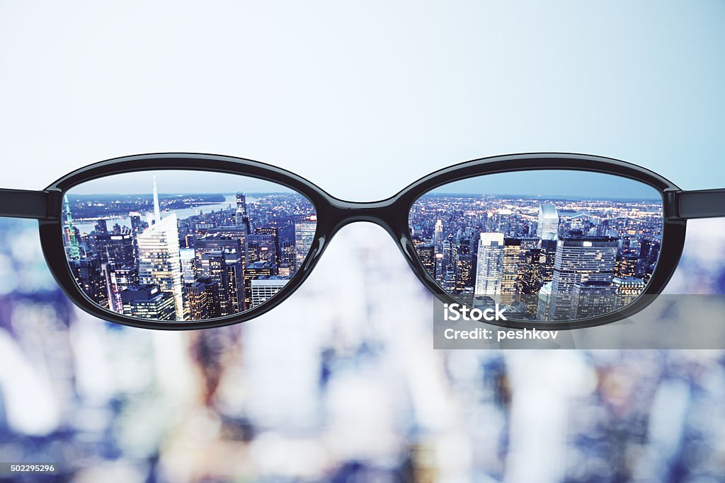 Clear vision concept with eyeglasses and night megapolis city ba Clear vision concept with eyeglasses and night megapolis city background Eyeglasses Stock Photo