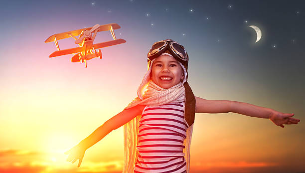 istock child playing with toy airplane 502295476