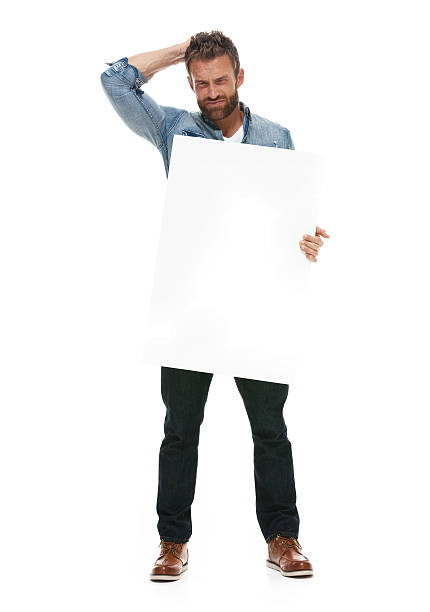 istock Upset casual man holding placard 502296342