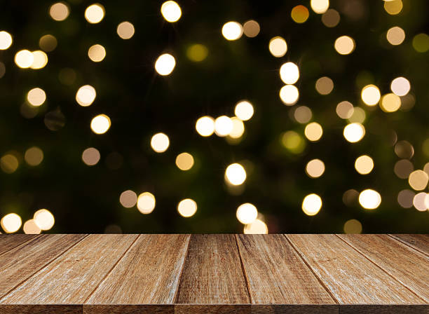 istock celebration background of Wood table on colorful light bokeh 502297304