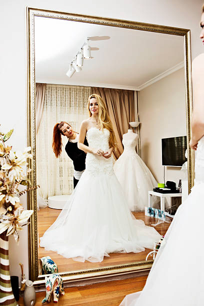 istock Wedding dress fitting in bridal boutiqe 502297480