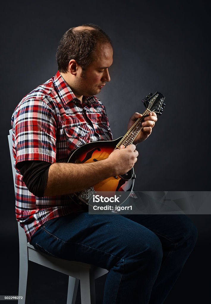 portrait of musician with mandolin portrait of musician with mandolin , studio shot 2015 Stock Photo