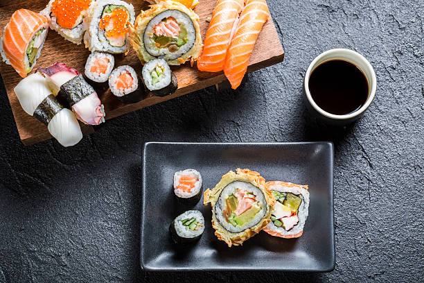 istock Sushi served with soy sauce on black stone 502298441