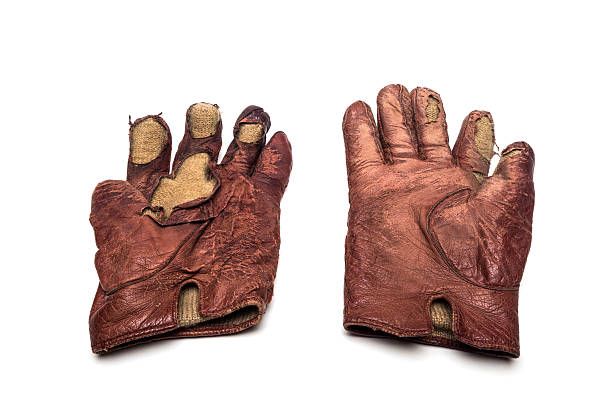istock Old torn pair of leather gloves on white background 502300005