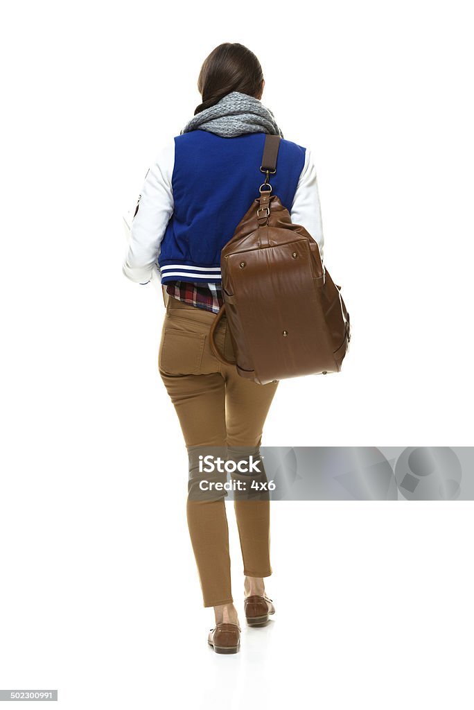Rear view of student walking Rear view of student walkinghttp://www.twodozendesign.info/i/1.png 20-29 Years Stock Photo