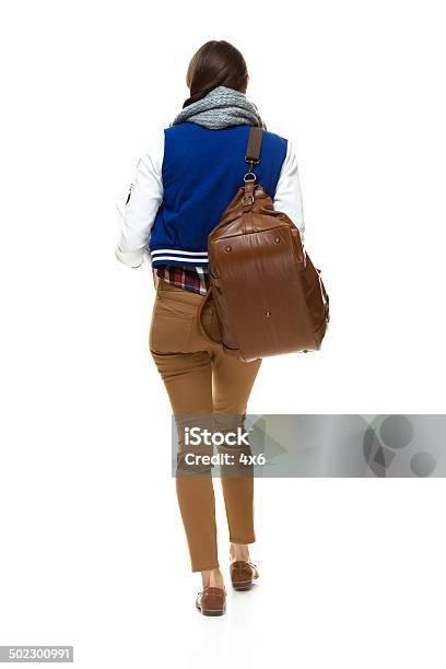 Rear View Of Student Walking Stock Photo - Download Image Now - 20-29 Years, Adult, Adults Only