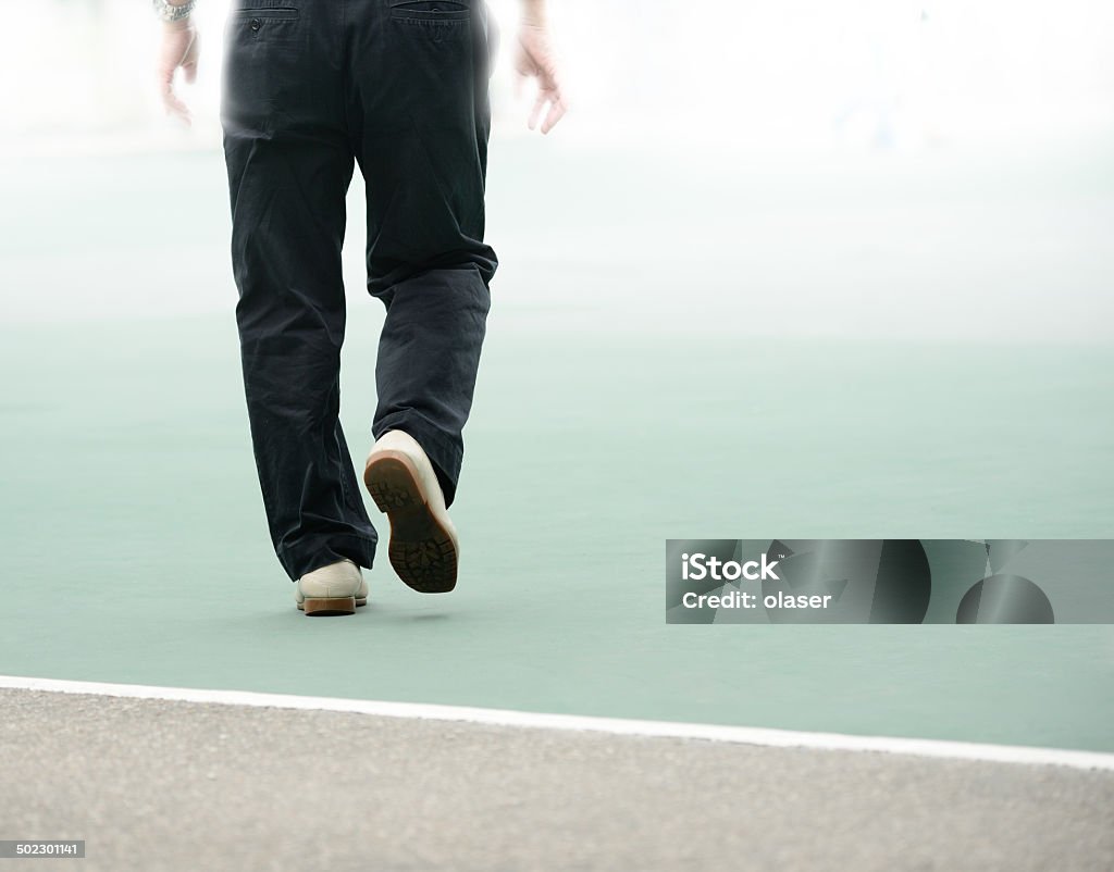 Crossing the line, walking into bright future Close up of person daring to cross the line Activity Stock Photo