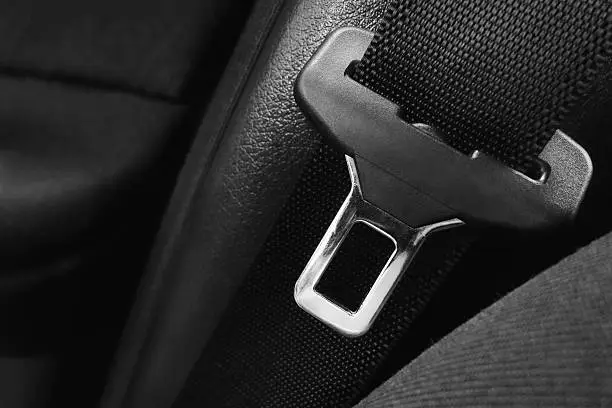 Close up of a open safety belt with black background