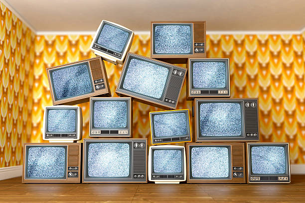 istock Stack of vintage old televisions showing static signal 502301701