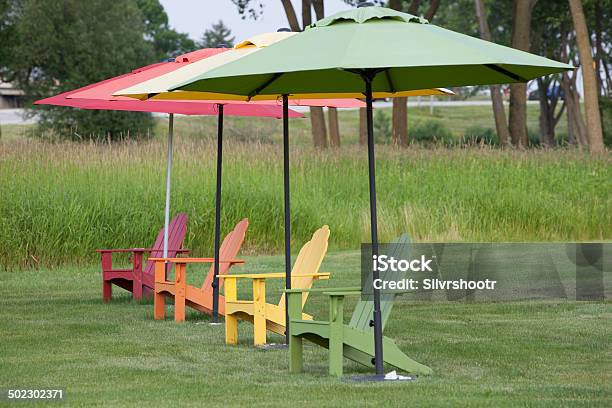 Colorful Adirondack Chairs In A Row Stock Photo - Download Image Now - Adirondack Chair, Blue, Chair