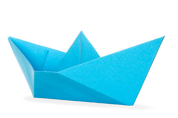 paper boat blue paper boat isolated on white toy boat stock pictures, royalty-free photos & images