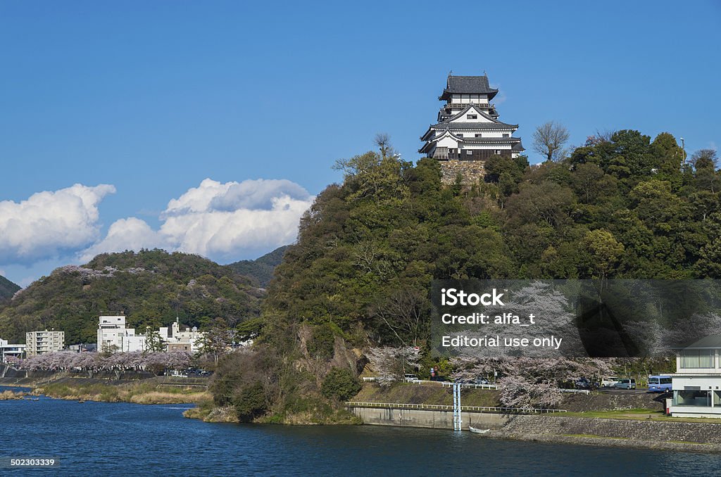 Japanese castle and cherry blossoms. Inuyama,  Japan - April 6, 2014:Inuyama Castle built in 1537. Castle Stock Photo