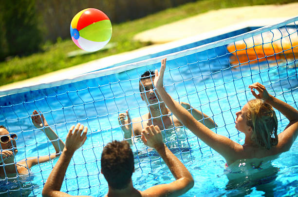 istock Friends playing volleybay in a pool. 502312630