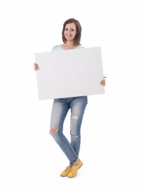 istock Happy beautiful woman holding blank white placard. 502312992