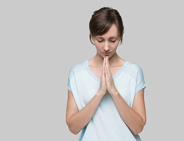 istock Woman praying 502313078