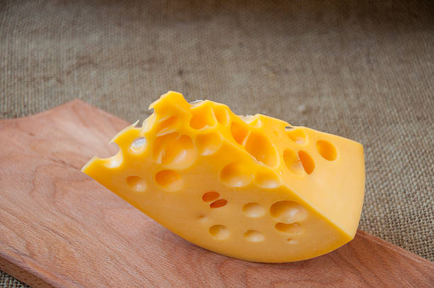 istock cheese on wooden cutting board 502316234