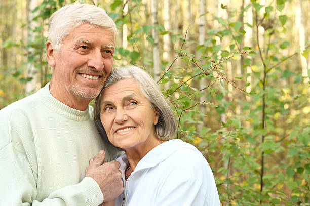 istock mature couple on  in summer park 502317044