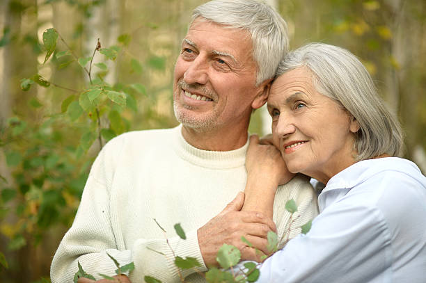istock mature couple on  in summer park 502317178