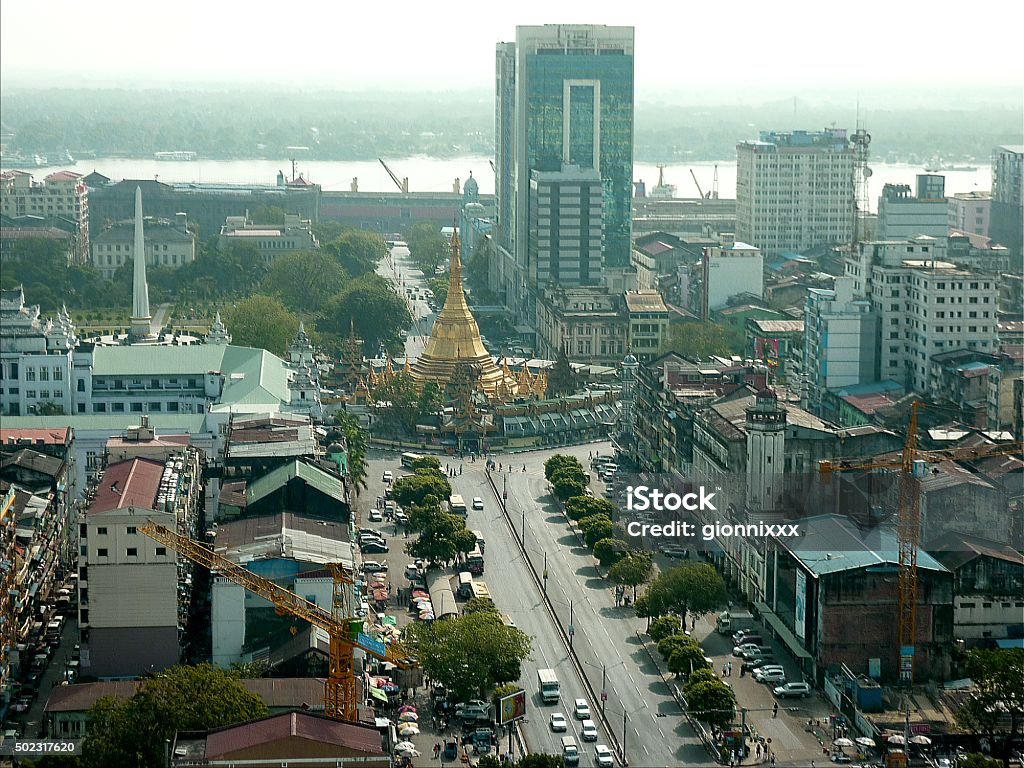 Yangon Cityscape, Myanmar Yangon downtown cityscape view from Sakura tower. In the background the golden Sule Pagoda and Yangon river,  Cityscape Stock Photo