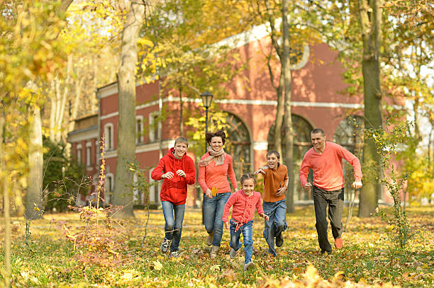 istock Family relaxing in autumn park 502317782