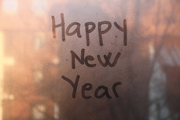 istock Happy New Year text written on the glass 502318524