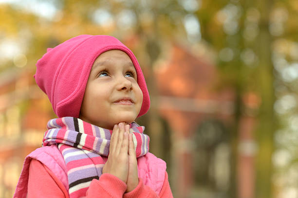istock Little Girl prays 502318536