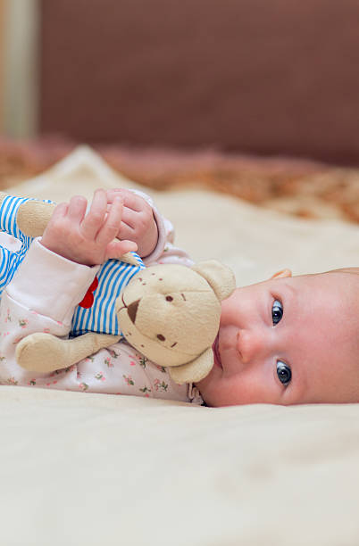 istock Infant child with a toy 502318548
