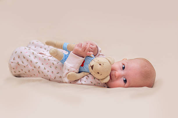 Infant child with a toy stock photo