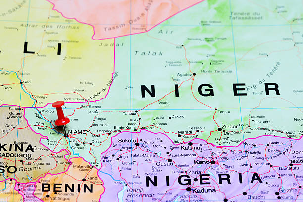 Niamey pinned on a map of Africa Photo of pinned Niamey on a map of Africa. May be used as illustration for traveling theme. niger stock pictures, royalty-free photos & images