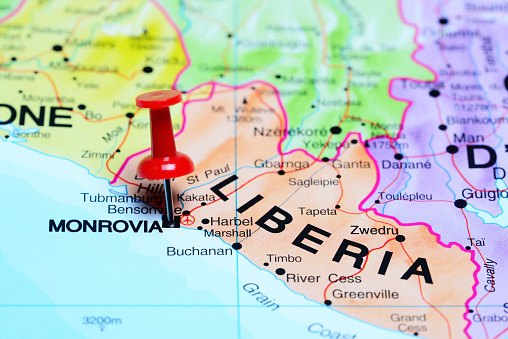 Photo of pinned Monrovia on a map of Africa. May be used as illustration for traveling theme.
