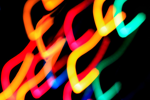 Holiday lights taken with soft focus and quick movement.
