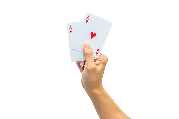 istock Playing cards in hand isolated on white background 502321062