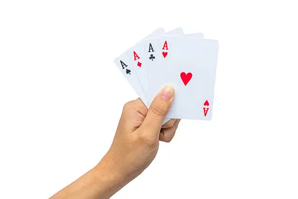 Photo of Playing cards in hand isolated on white background