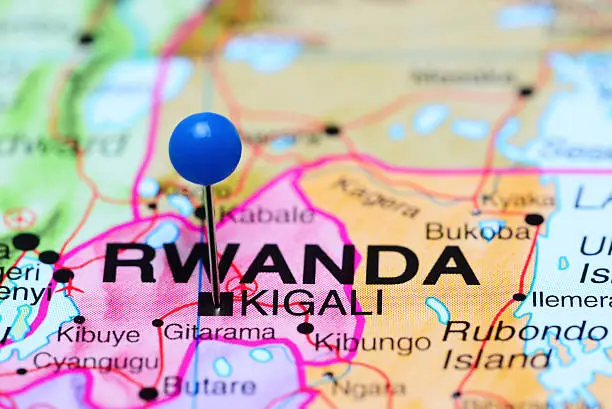 Photo of pinned Kigali on a map of Africa. May be used as illustration for traveling theme.