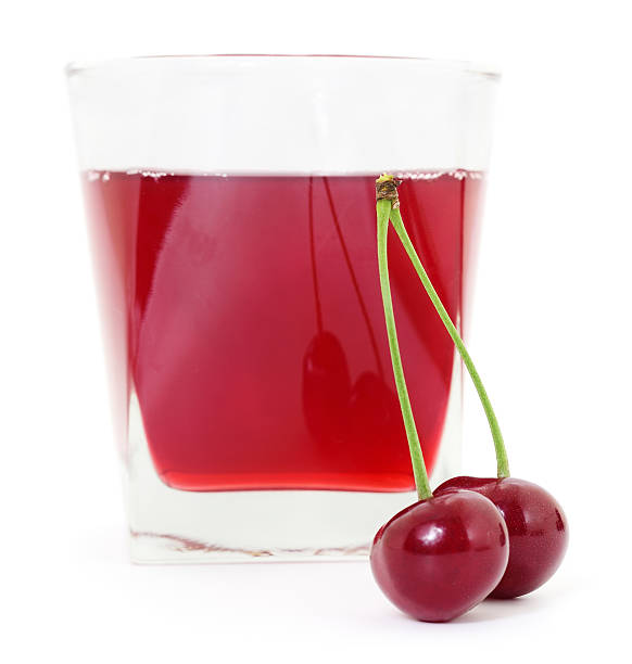 istock Cherries and a glass of cherry juice 502321704