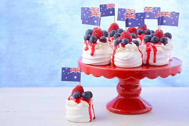 Australian mini pavlovas and flags in red, white and blue for Australia Day or national holiday party food treats.