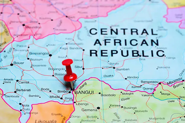 Photo of pinned Bangui on a map of Africa. May be used as illustration for traveling theme.