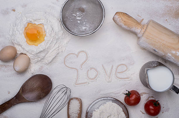 istock heart of flour on wooden desk 502322708