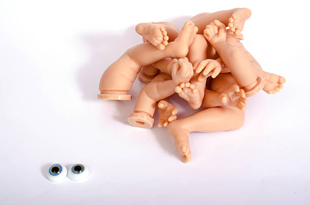istock Details of dolls: hands and feet and eyes. 502322740