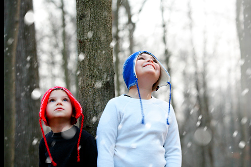 These two brothers, both diagnosed with autism and ADHD, enjoy being outside together. You can sense the wonder and joy they feel as they look up at the first snow fall of the winter season. 