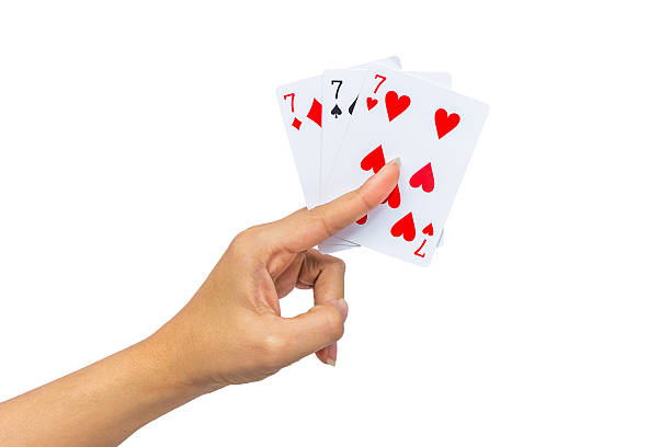 istock Playing cards in hand isolated on white background 502323232
