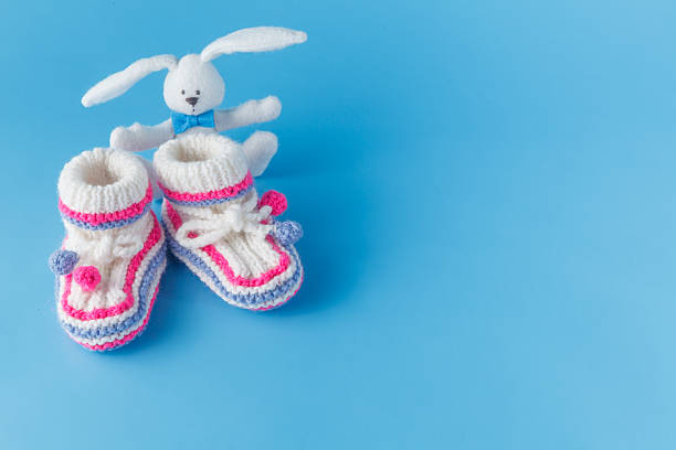 istock Handmade knitted booties  with toy 502323964
